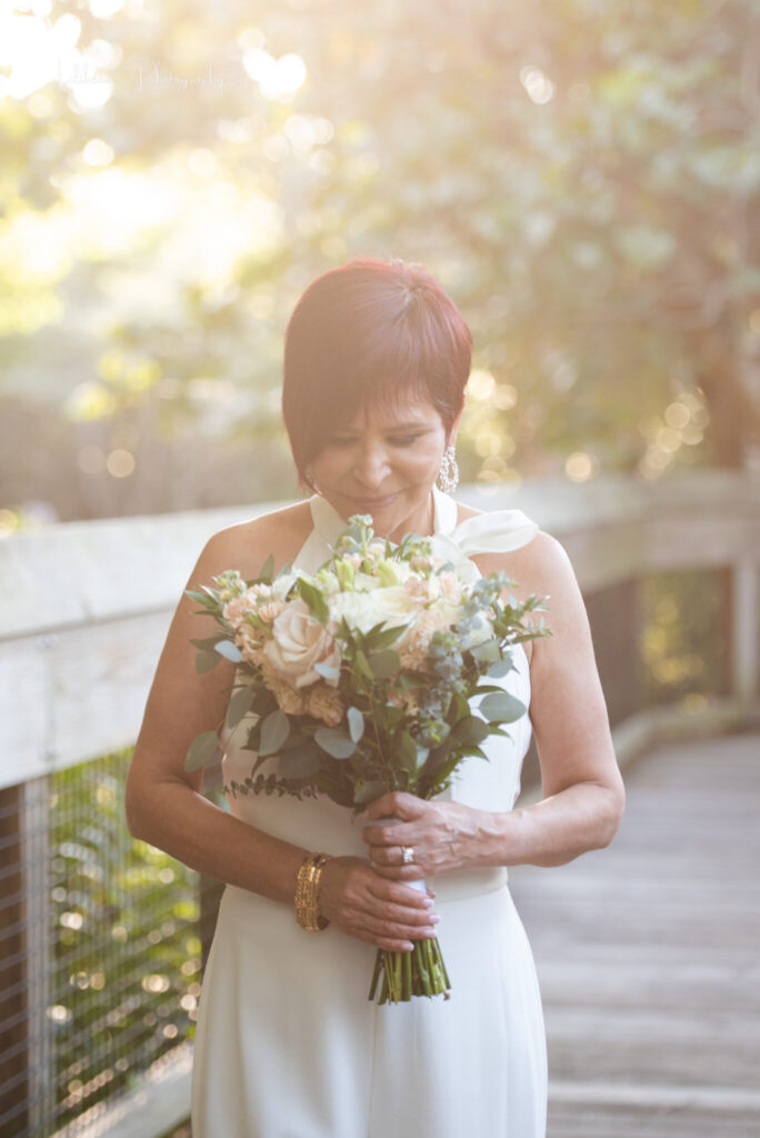 bride smelling flowers