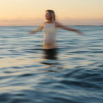 pregnancy session at the beach during sunrise