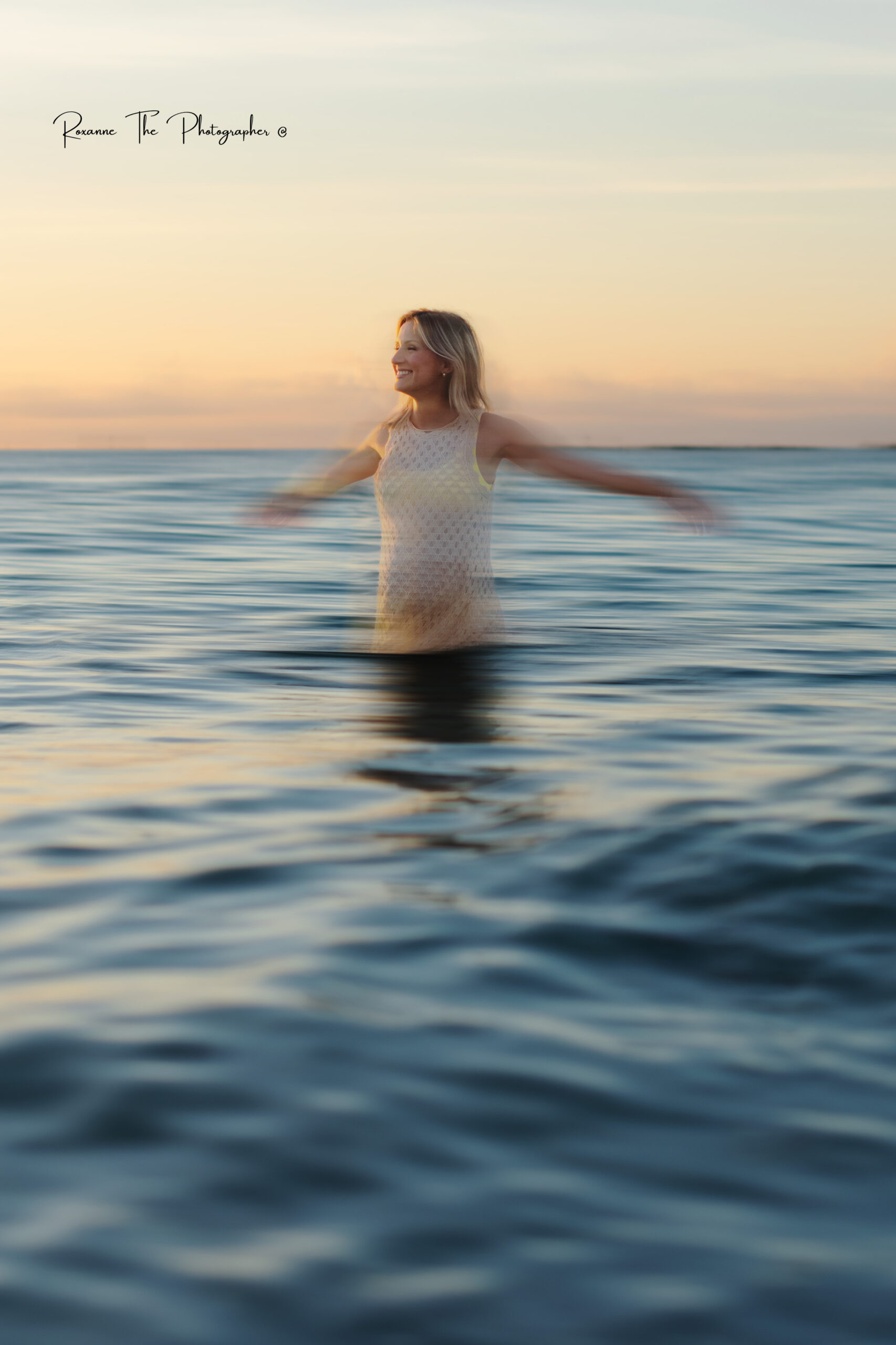 pregnancy session at the beach during sunrise